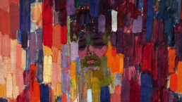 Closeup of colorful painting. A face appears among patches of color
